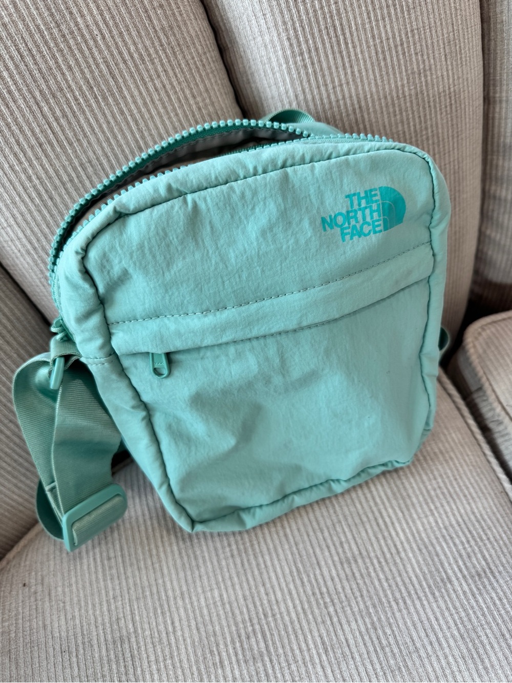 The North Face Mint Green Never Stop Crossbody Bag color is Wasabi